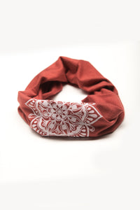 Eye See You by Melody Tunks - brick red fabric with white ink - mandala design - rolled like neck gaiter